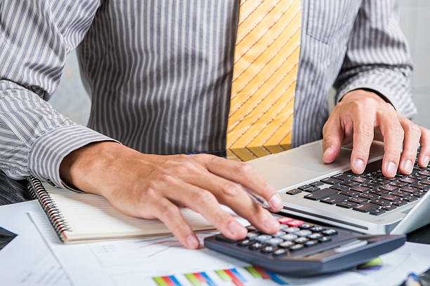 istock Businessman analyzing investment charts with laptop. Accounting 518817405