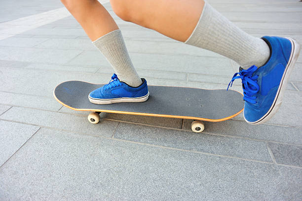 istock speeding skateboarding woman legs 518817557