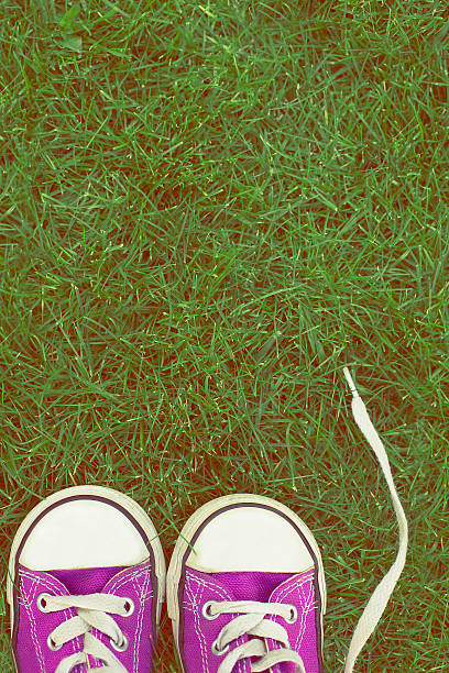 outdoor portrait of a little girl sneakers shoes