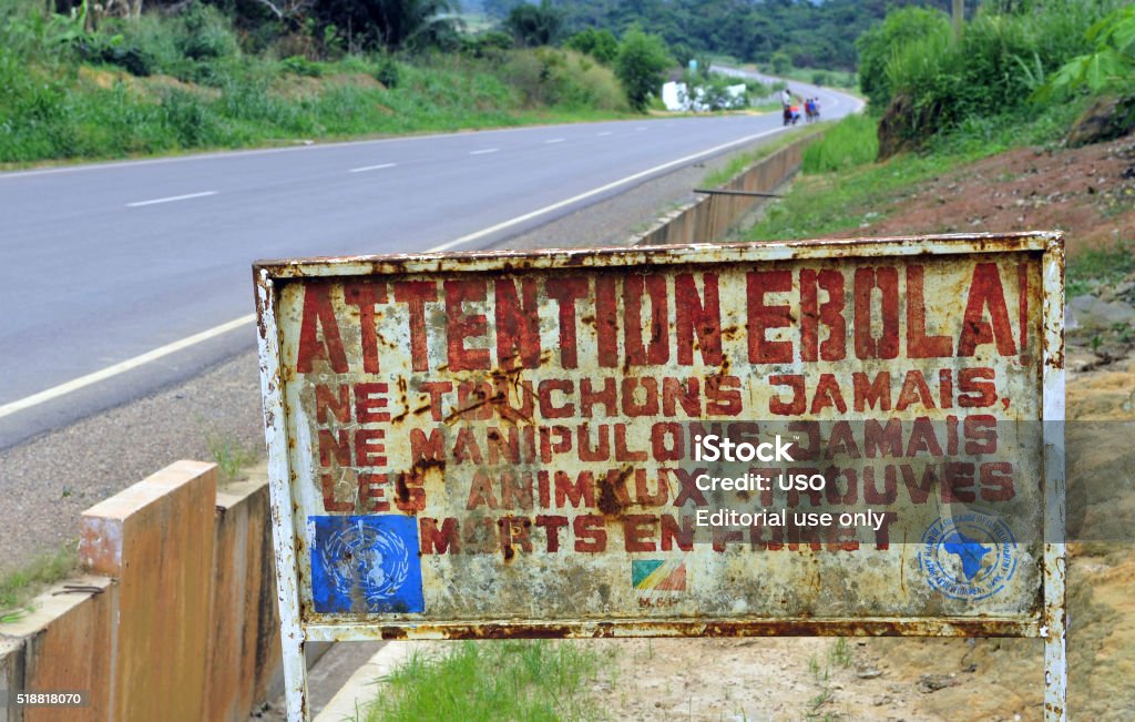 Attention, Ebola! Makoua, Congo,- September 27, 2013: A sign warns visitors that area is an Ebola infected. Signage informing visitors that they are entering the ebola infected area.  Ebola Stock Photo