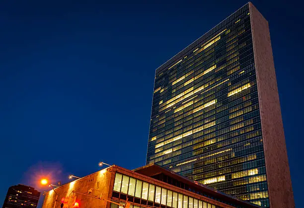 United Nations headquarters (UN building ) at night in Midtown Manhattan,  New York city, USA