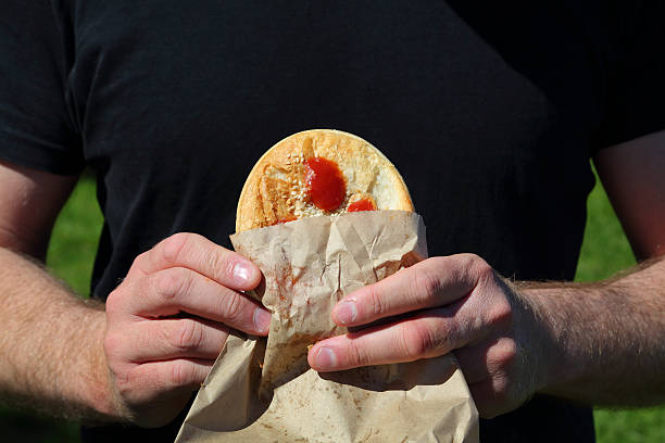 Meat Pie with Sauce Typical lunch on the run for Australians. savoury pie stock pictures, royalty-free photos & images