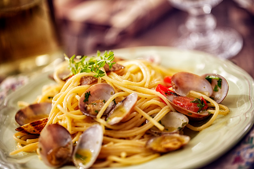 Delicious homemade Spaghetti Vongole with garlic, chili, parsley and white wine served on a plate