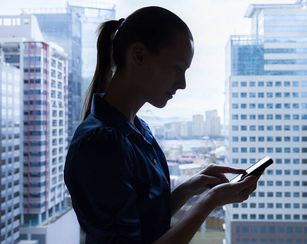 istock Businesswoman using mobile smart phone 518820003
