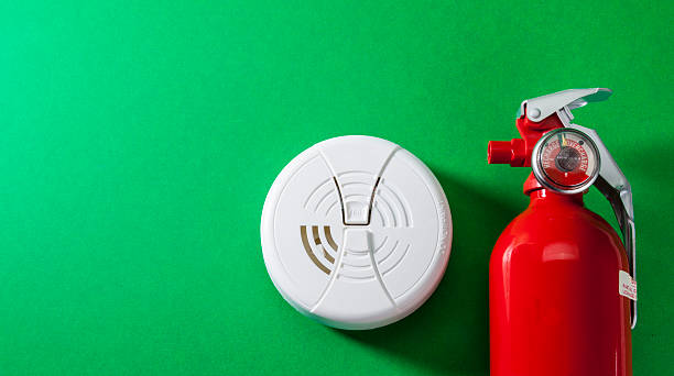 Fire Safety and Prevention Fire extinguisher, smoke detector and carbon monoxide alarm. smoke detector photos stock pictures, royalty-free photos & images
