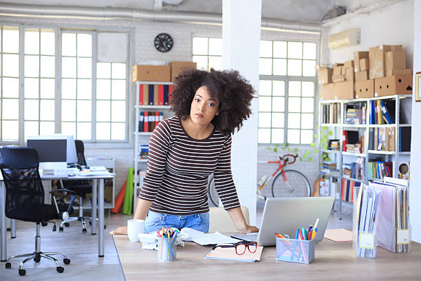 istock Young woman at her office 518820342