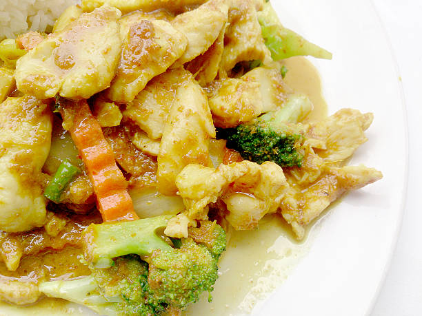 istock Green curry fried Vegetable with chicken on dish,Thai Food 518828496