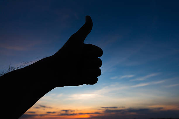 istock Like shape hand silhouette in sky 518830561