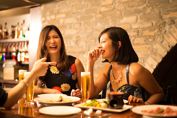 Woman is drunk are pointing in the restaurant Woman is drunk are pointing in the restaurant formal dinning stock pictures, royalty-free photos & images