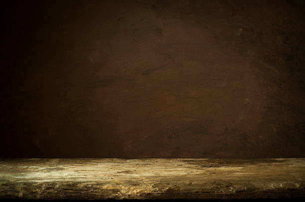 istock Vintage wood table in woods wall room. 518831122