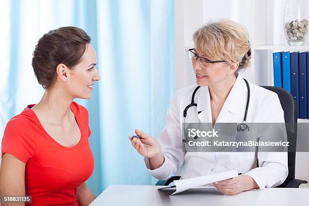 Happy Patient At Doctors Office Stock Photo - Download Image Now - Adult, Apron, Asking