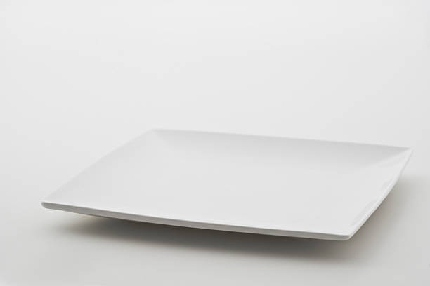 istock Square porcelain plate on white background 518831229