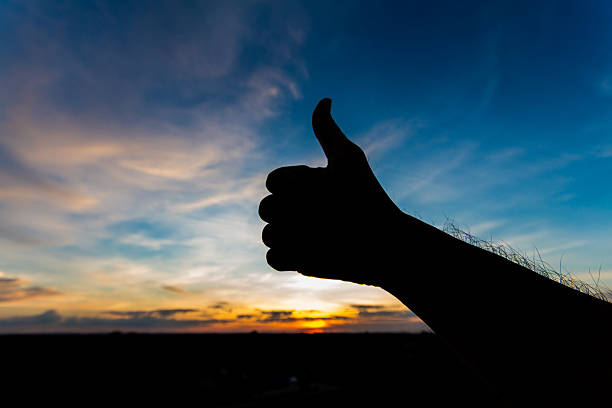 istock Like shape hand silhouette in sky 518831455