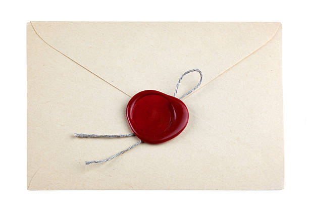 istock old mail envelope with red wax seal stamps 518833211