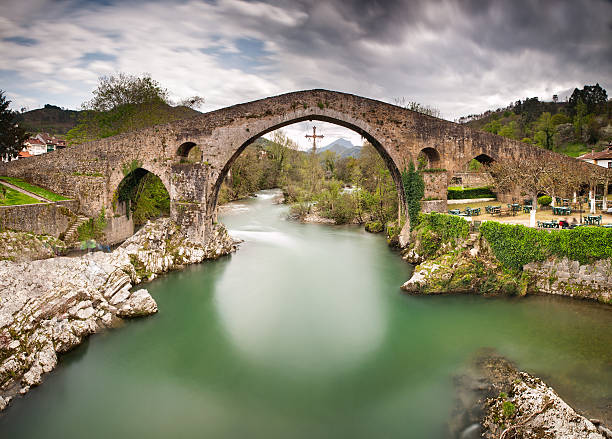 istock Old Roman stone bridge in Cangas de Onis (Asturias), Spain. 518836917