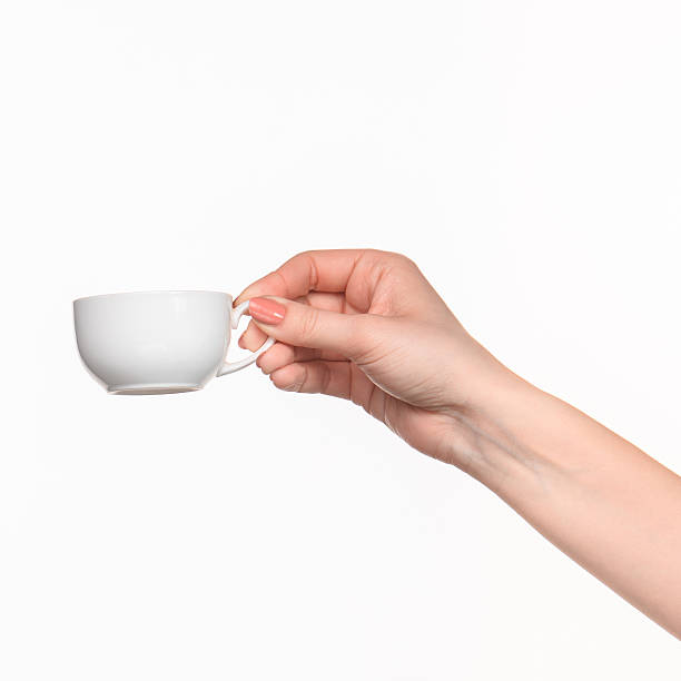istock Woman hand with cup on white background 518844228