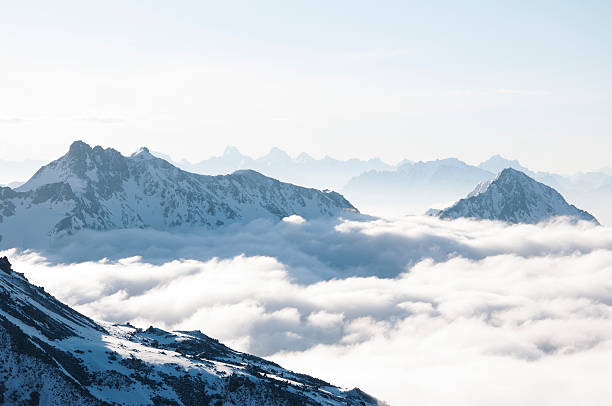 istock Mountains sticking out of clouds 518845286