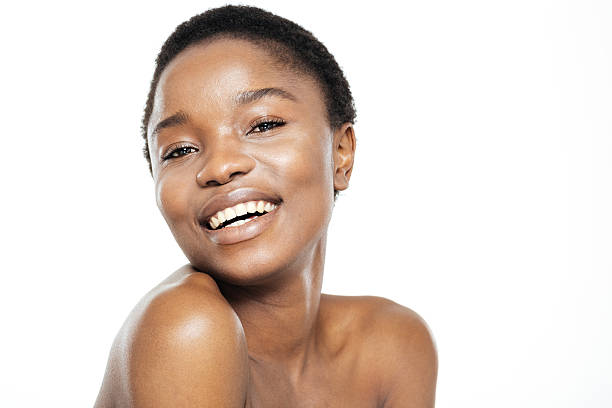 istock Smiling cute afro american woman looking at camera 518845560