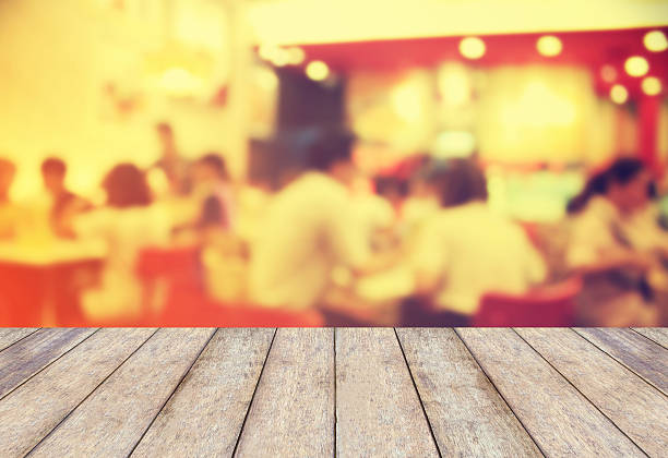 istock Perspective wood with blurred cafe bokeh light background 518846552