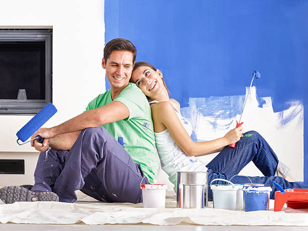 istock Happy Young Couple Decorating New Home 518847096
