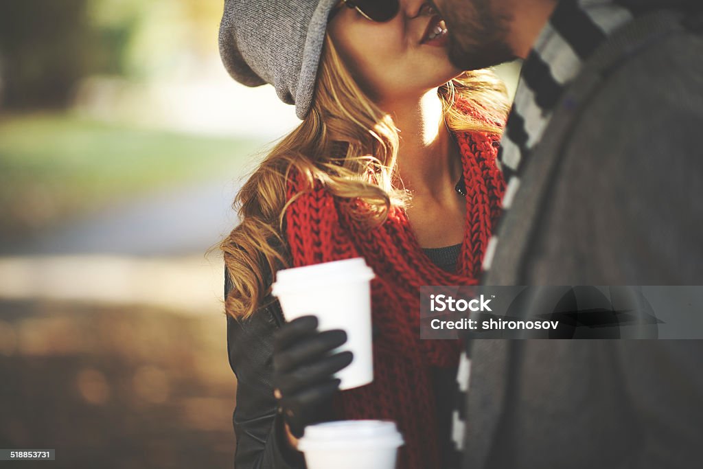 Autumn kiss Young people kissing outdoors Adult Stock Photo