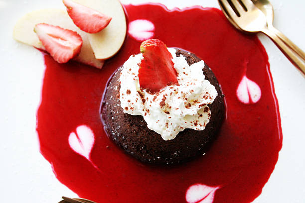 istock Molten Lava Chocolate Cake with strawberry sauce 518854817