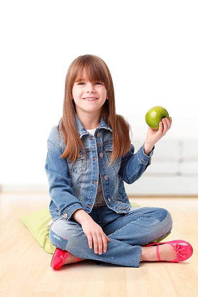 istock Cute girl with an apple 518856846