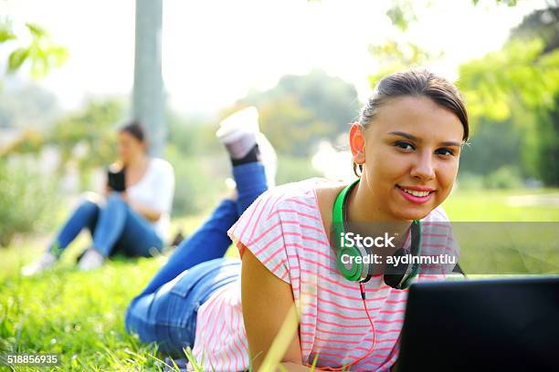 Using A Laptop Outdoors Stock Photo - Download Image Now - 20-24 Years, 20-29 Years, Adult