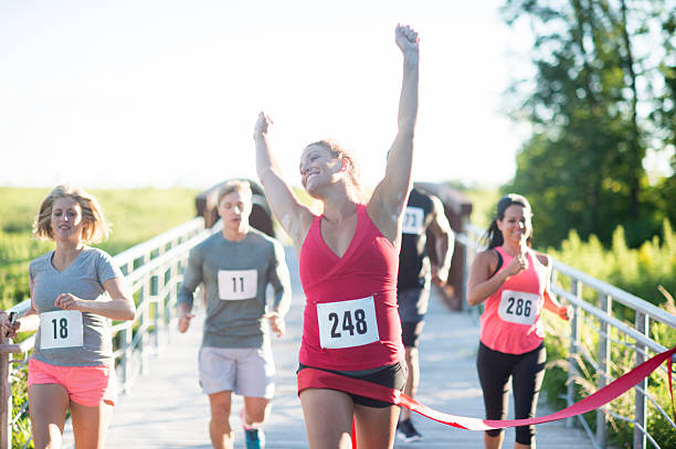 istock Ecstatically Crossing the Finish Line 518858124