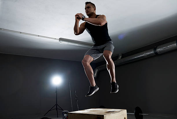 istock High jump on the wooden box 518859346