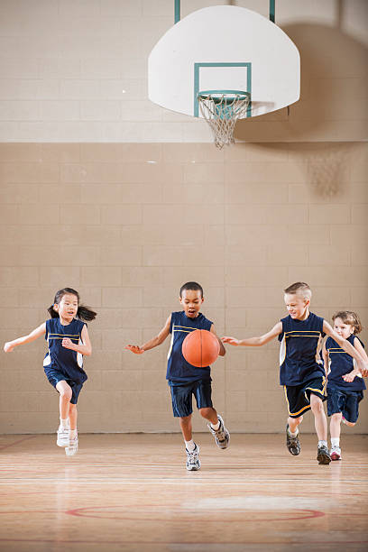 istock Children Playing a Basketball Game 518859744