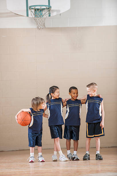 Children Standing in a Row Before the Game