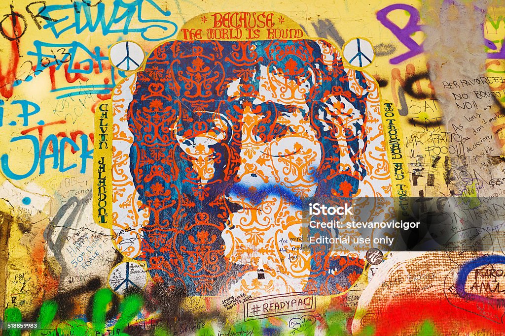 John Lennon Graffiti Wall on Kampa Island in Prague Prague, Czech Republic - September 11, 2014: Famous John Lennon Wall on Kampa Island in Prague is filled with Beatles inspired graffiti and pieces of lyrics since the 1980s. Graffities are drawn on daily basis. Love - Emotion Stock Photo