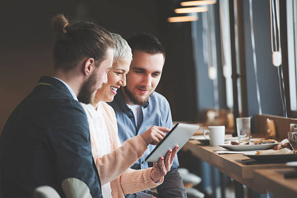 Business people at cafe Banquet coffee break at conference meeting, people talking, woman using digital tablet buffet hotel people women stock pictures, royalty-free photos & images