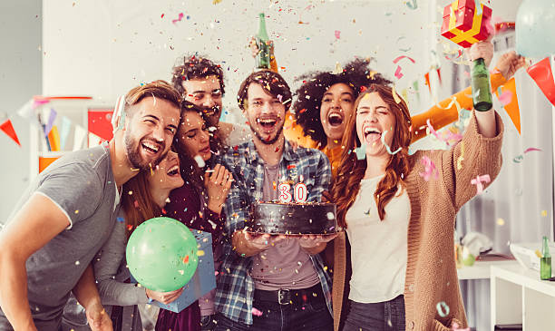 Birthday party in the office Group of friends at office birthday party office parties stock pictures, royalty-free photos & images