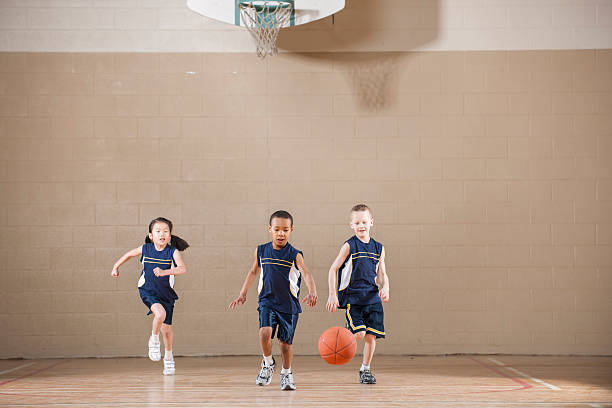 istock Playing a Basketball Game in the Gym 518868352