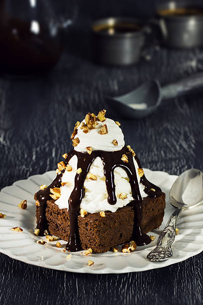 istock Brownie Sundae with Vanilla Ice Cream, Chocolate Sauce, and Nuts 518868864
