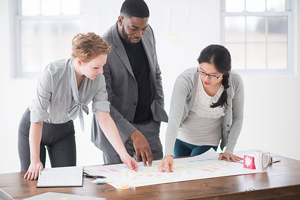 istock Multi-ethnic group of business assocaites are working 518868938