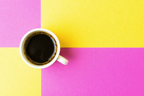 istock Cup of coffee on multicolored background 518869640