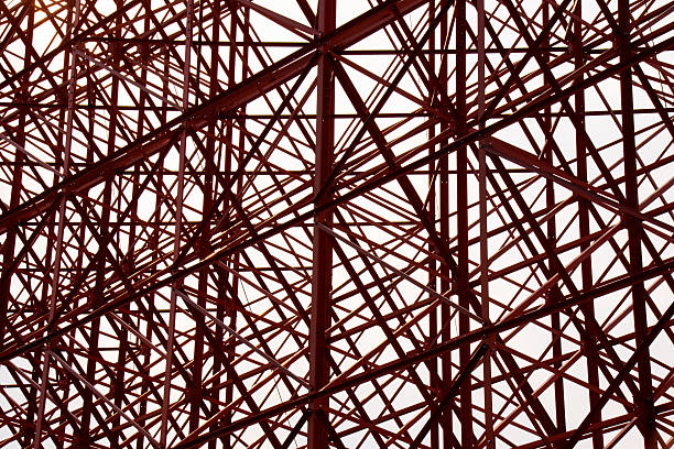 istock Structural orange steel cross construction abstract background 518869674