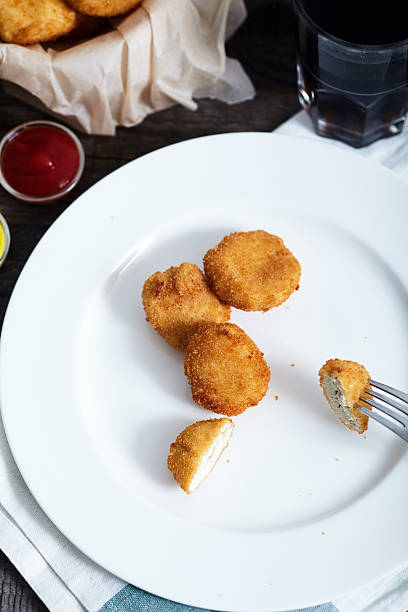 istock Fast food composition: chicken nuggets with ketchup and cola 518870188