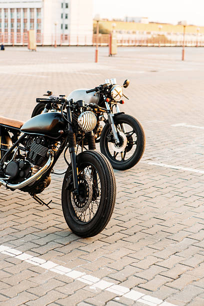 istock Two black and silver vintage custom motorcycles caferacers 518870684