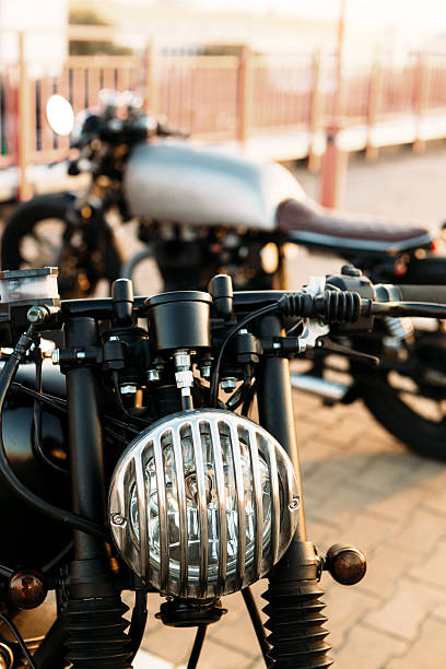 istock Two black and silver vintage custom motorcycles cafe racers 518871088