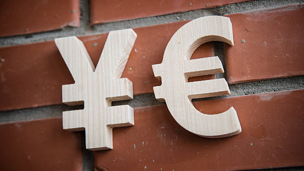 istock Exchange currency Yen, Euro on a brick wall 518871748