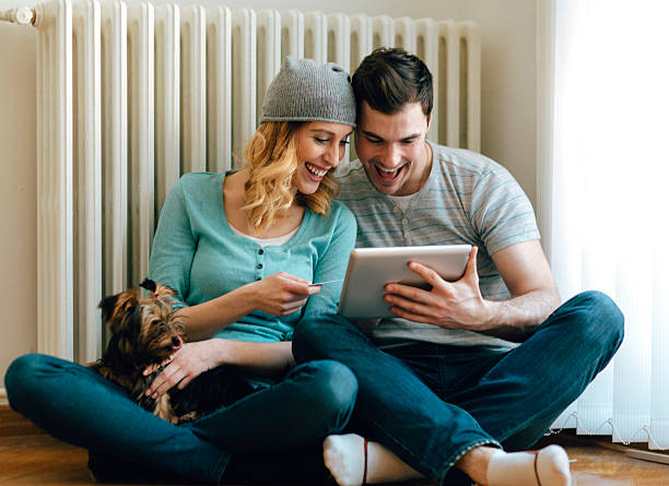 Happy Couple Shopping Online On Digital Tablet.