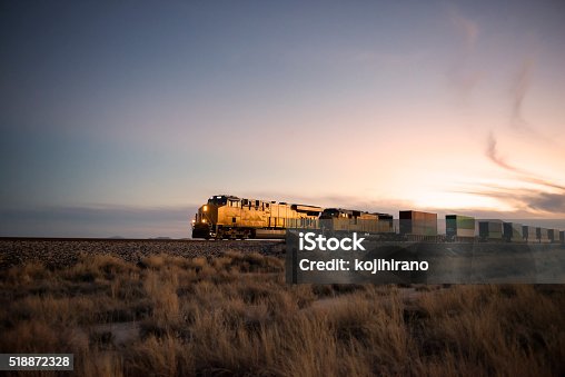 istock Railroad locomotive at dusk 518872328
