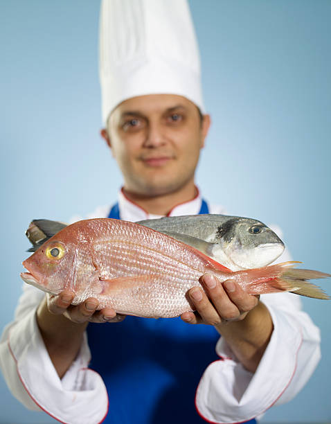 Chef Showing Raw Fish