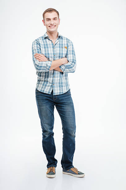 istock Smiling casual man standing with arms folded 518873338