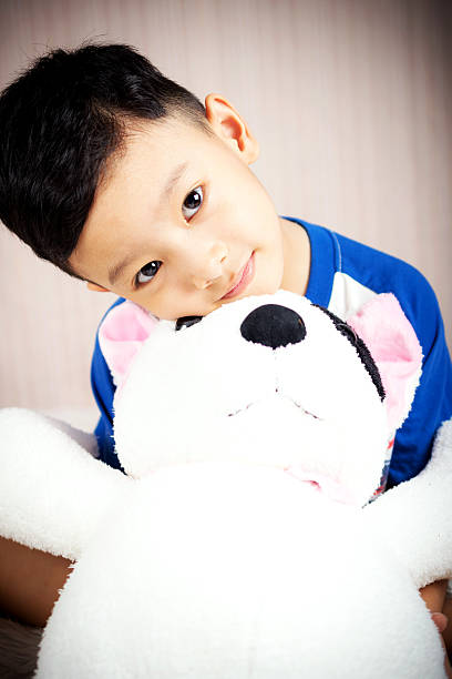 istock The boy is happy with doll dog 518873356