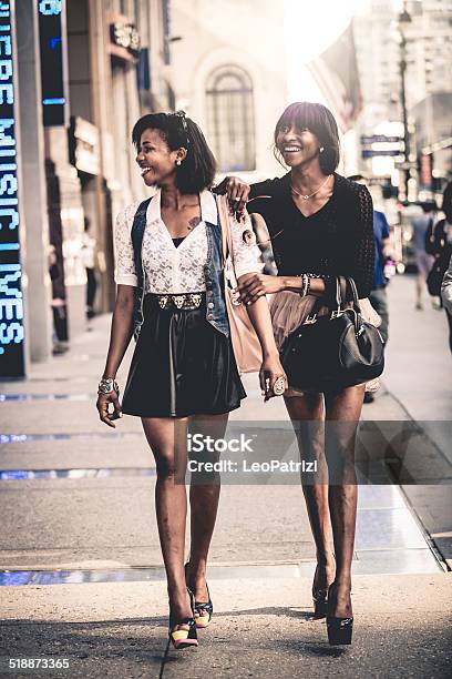 Two Friends Walking Down The Streets Stock Photo - Download Image Now - Fashion Model, Elegance, African Ethnicity